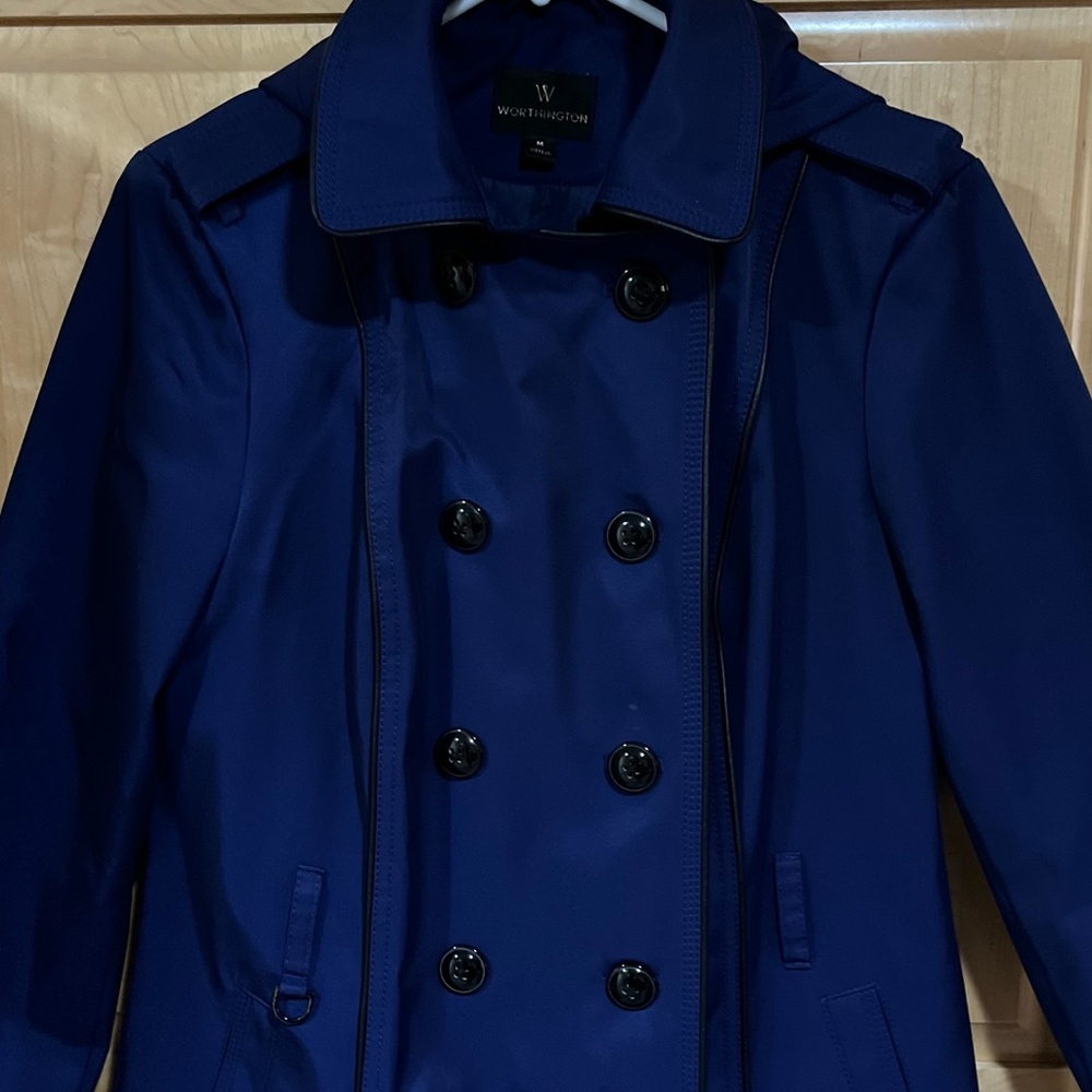 Overcoat for Spring. Double button front, pockets, detail on belt loop. No belt